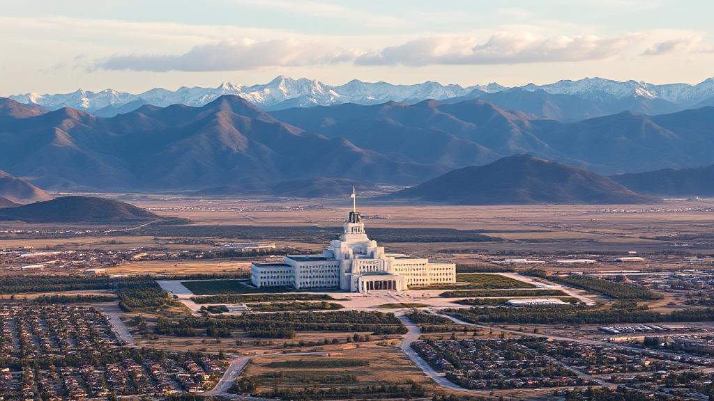 Aerial view of the United States Air Force Academy nestled against the backdrop of the Rocky Mountains in Colorado Springs.
